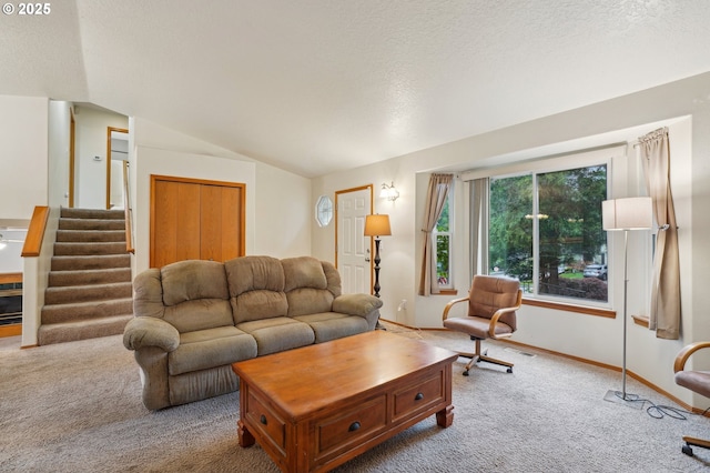 17701 Koch Ct, Sandy, OR 97055 - carpeted living area featuring lofted ceiling, stairway, baseboards, and a textured ceiling
