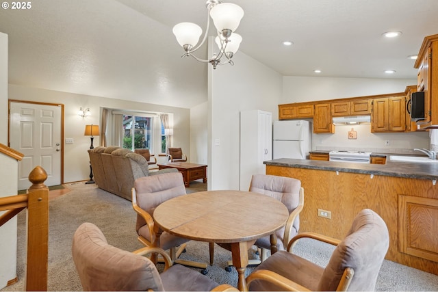 17701 Koch Ct, Sandy, OR 97055 - dining room with light carpet, vaulted ceiling, a chandelier, and recessed lighting