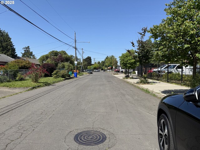 8305 SE Rhone St, Portland, OR 97266 - view of asphalt road featuring sidewalks