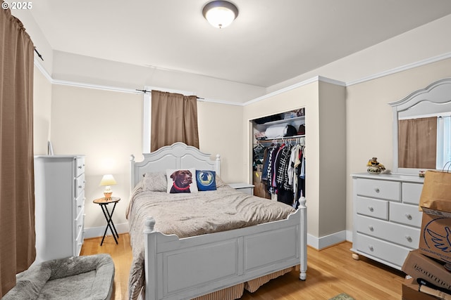 bedroom featuring a closet and light hardwood / wood-style flooring