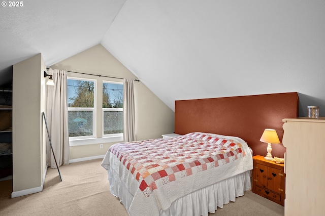 carpeted bedroom with vaulted ceiling