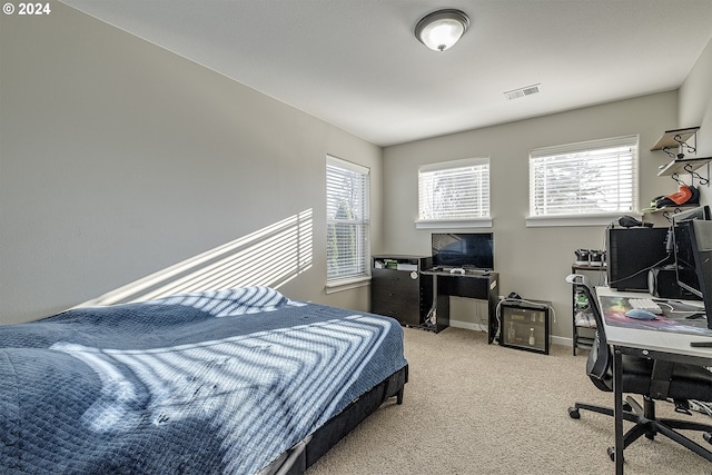 bedroom featuring visible vents, carpet flooring, baseboards, and multiple windows