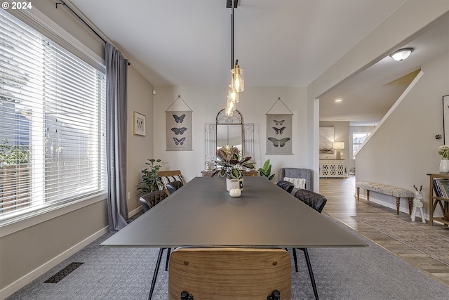 dining room featuring baseboards and visible vents