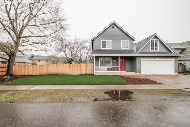 traditional home featuring driveway, a porch, fence, a front yard, and a garage