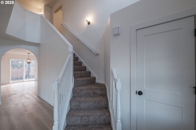 stairs featuring hardwood / wood-style flooring