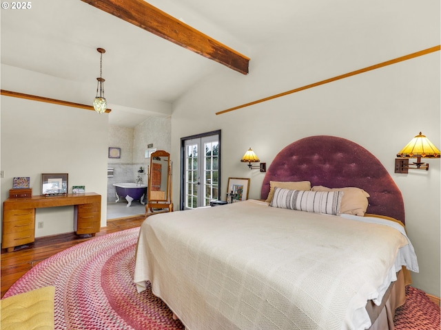 bedroom with beamed ceiling and wood finished floors