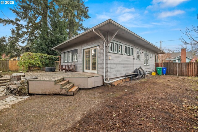 view of side of property with a wooden deck