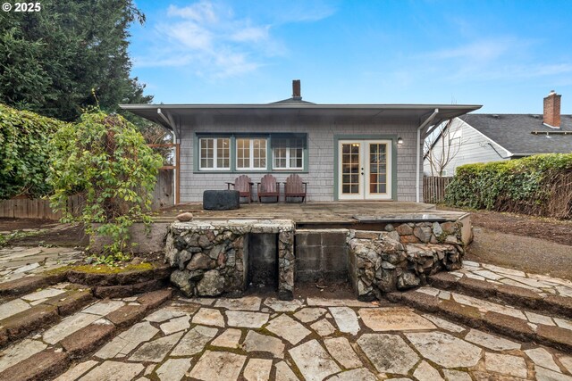 back of property featuring french doors