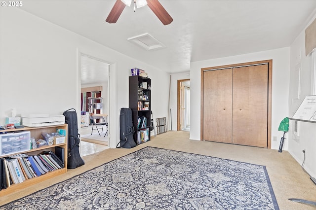 interior space featuring ceiling fan and carpet floors