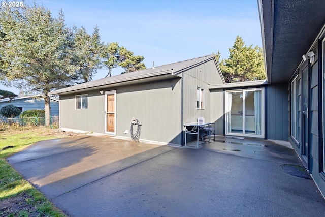 rear view of house with a patio