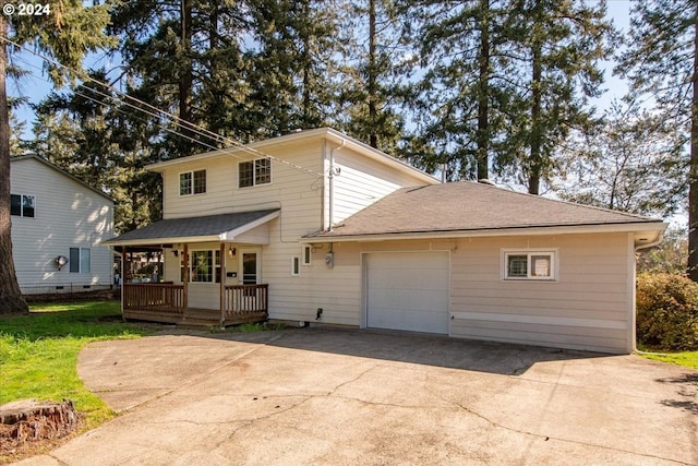 view of front of home featuring a garage and a porch