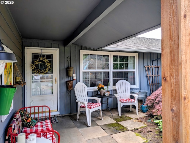 695 NW Towle Ave, Gresham, OR 97030 - view of exterior entry with board and batten siding, a shingled roof, and covered porch