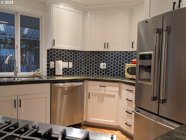 695 NW Towle Ave, Gresham, OR 97030 - kitchen featuring stainless steel appliances, white cabinets, decorative backsplash, and dark stone countertops