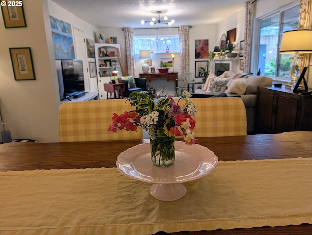 695 NW Towle Ave, Gresham, OR 97030 - dining room with healthy amount of natural light and a chandelier