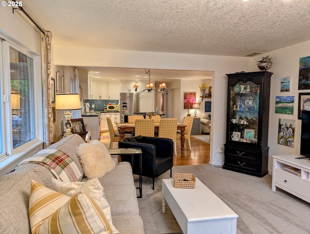 695 NW Towle Ave, Gresham, OR 97030 - living area with a chandelier and a textured ceiling