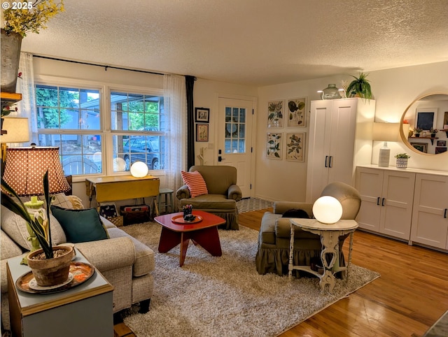 695 NW Towle Ave, Gresham, OR 97030 - living area featuring a textured ceiling and wood finished floors