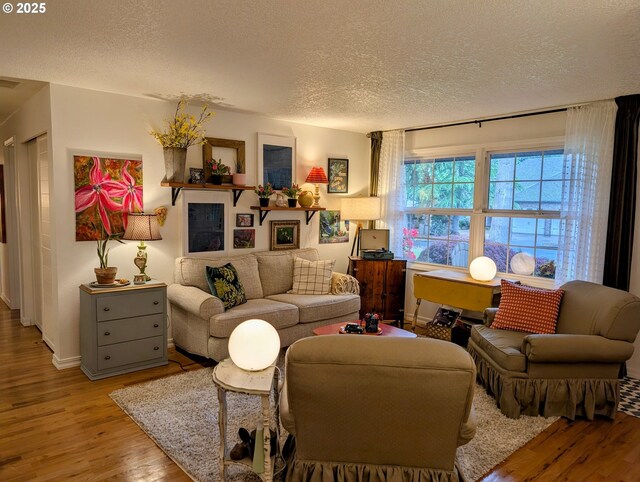 695 NW Towle Ave, Gresham, OR 97030 - living area featuring a textured ceiling and wood finished floors