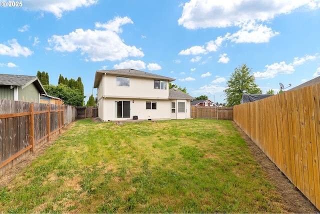 rear view of property featuring stucco siding