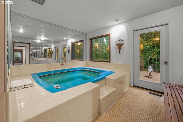 view of swimming pool featuring an indoor in ground hot tub