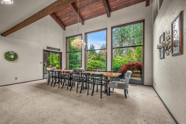 dining area with a textured wall, wood ceiling, beamed ceiling, carpet flooring, and high vaulted ceiling