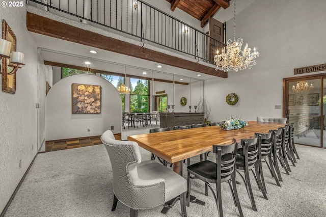 carpeted dining space with an inviting chandelier, high vaulted ceiling, wooden ceiling, beamed ceiling, and baseboards