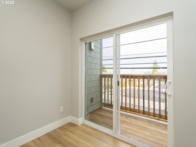 entryway featuring light wood-style floors and baseboards