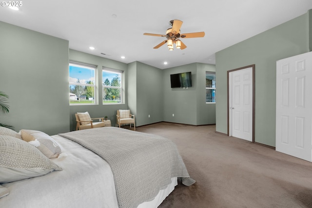 carpeted bedroom featuring baseboards, a ceiling fan, and recessed lighting