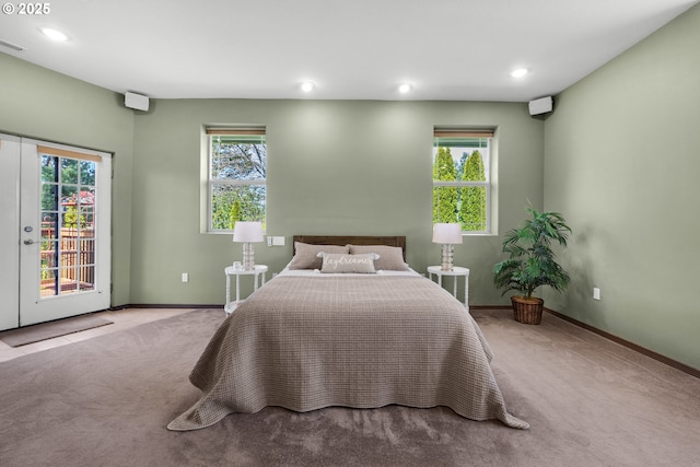 carpeted bedroom with access to exterior, multiple windows, baseboards, and recessed lighting