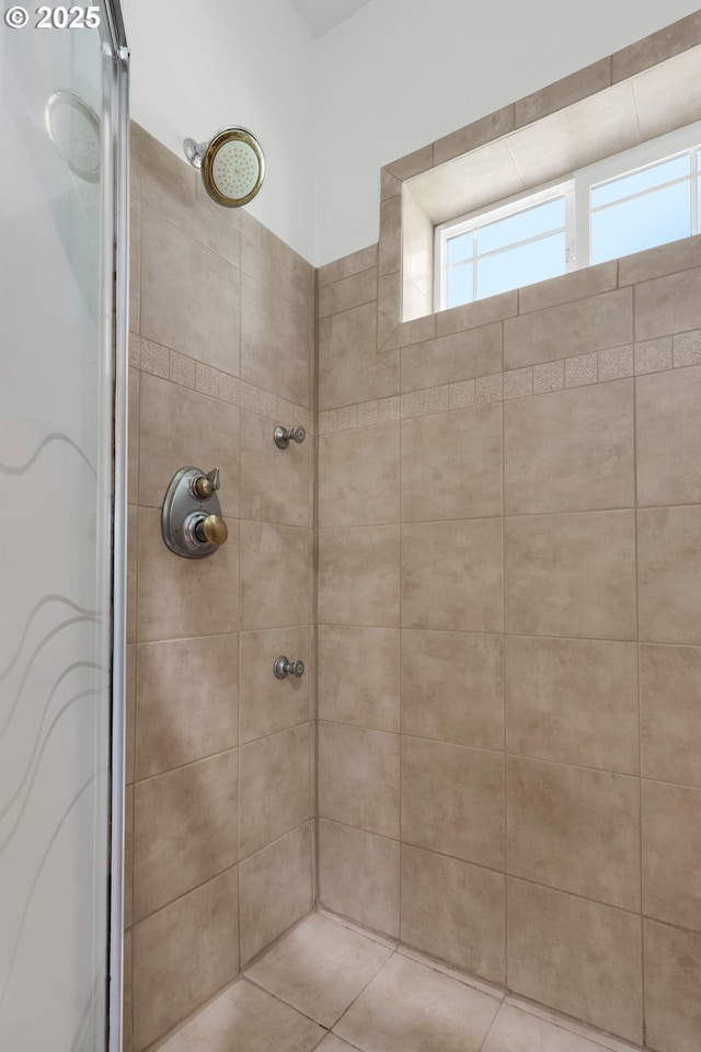 full bath featuring a tile shower