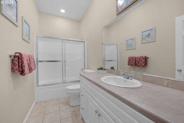 full bath featuring baseboards, bath / shower combo with glass door, toilet, tile patterned floors, and vanity