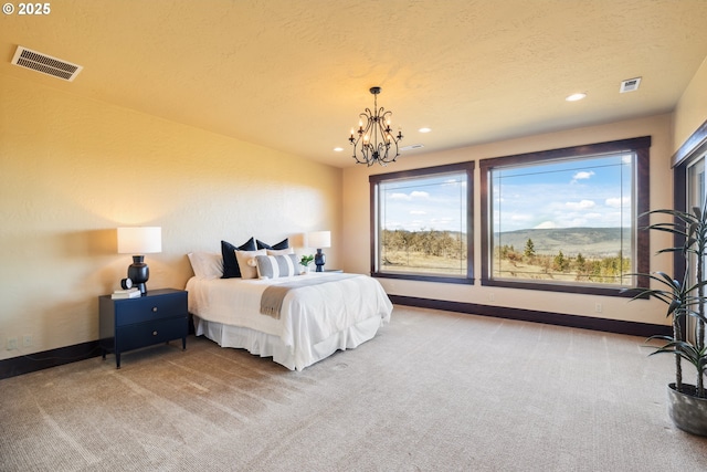 carpeted bedroom featuring a chandelier, recessed lighting, visible vents, and baseboards