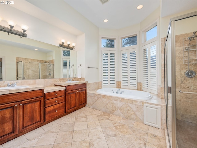 1303 NE 147th Ave, Vancouver, WA 98684 - bathroom with a shower stall, a bath, double vanity, tile patterned flooring, and recessed lighting