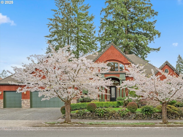 1303 NE 147th Ave, Vancouver, WA 98684 - view of front of property featuring driveway, an attached garage, and stone siding