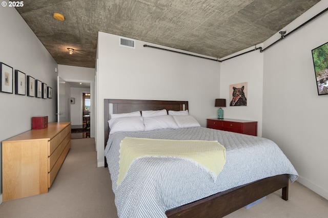 1926 W Burnside St Unit 1401, Portland, OR 97209 - bedroom with light carpet, a barn door, and baseboards