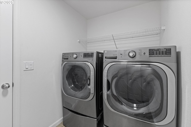 12800 Joys Dr, Oregon City, OR 97045 - laundry room featuring separate washer and dryer and baseboards