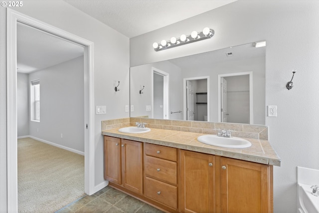 12800 Joys Dr, Oregon City, OR 97045 - bathroom featuring double vanity and baseboards