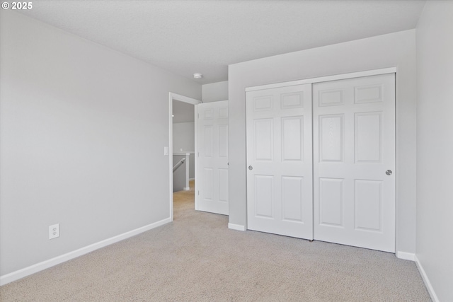 12800 Joys Dr, Oregon City, OR 97045 - unfurnished bedroom featuring carpet floors, baseboards, and a closet