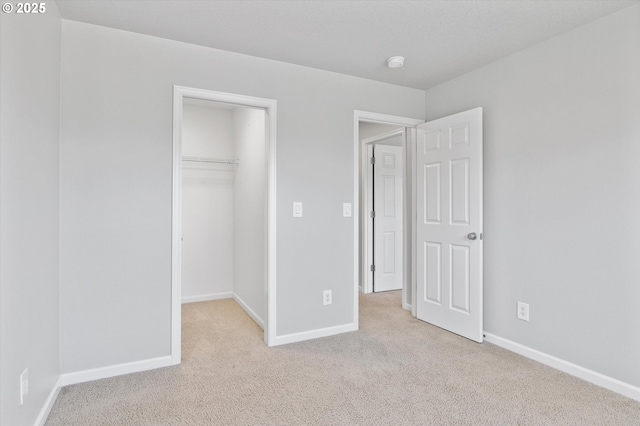 12800 Joys Dr, Oregon City, OR 97045 - unfurnished bedroom with carpet floors, baseboards, a spacious closet, and a closet
