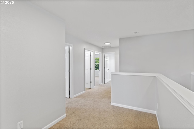 12800 Joys Dr, Oregon City, OR 97045 - corridor featuring an upstairs landing, baseboards, and light carpet