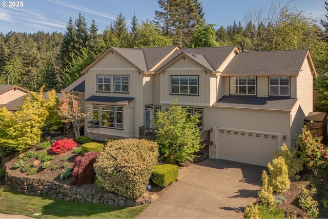 19624 SW Cooperhawk Ct, Beaverton, OR 97007 - view of front of home featuring concrete driveway, an attached garage, and board and batten siding