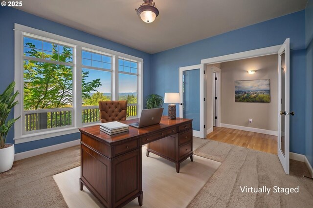 office featuring baseboards and french doors
