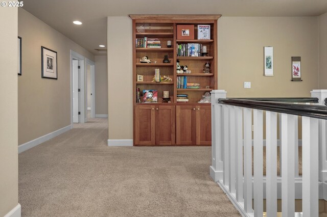 hall with light carpet, recessed lighting, and baseboards