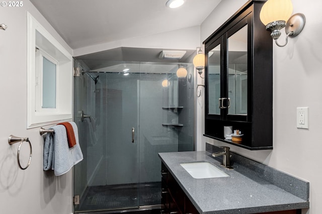 bathroom with walk in shower and vanity