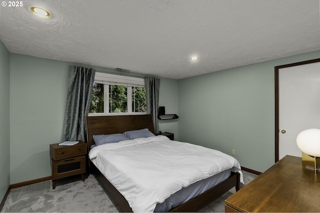 bedroom featuring light colored carpet