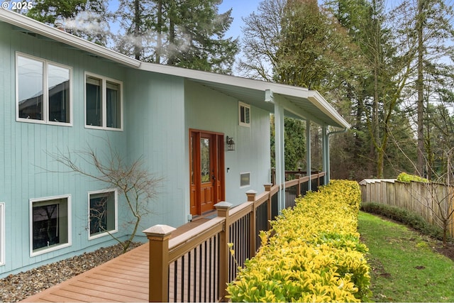 property entrance with a wooden deck