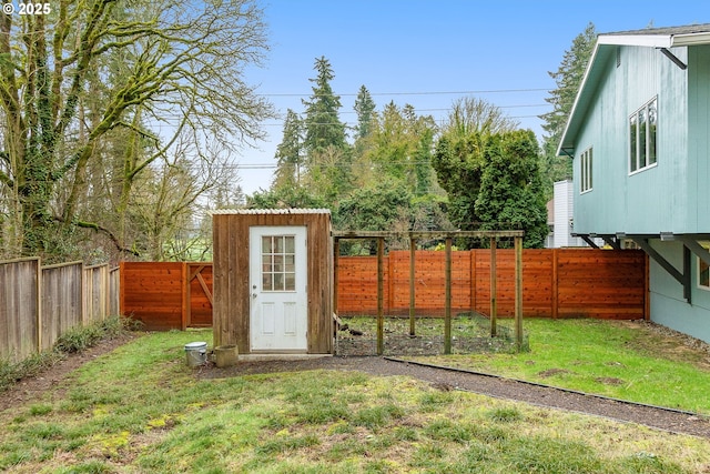 view of outbuilding featuring a lawn