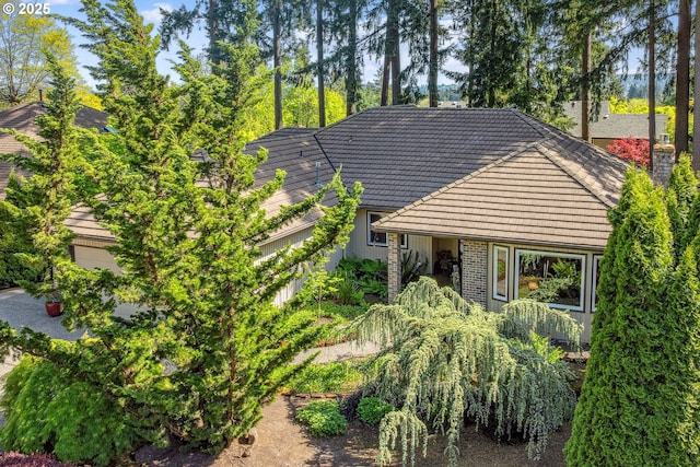 exterior space with a tile roof