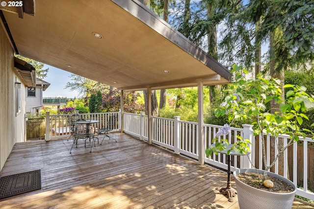 wooden deck with outdoor dining area
