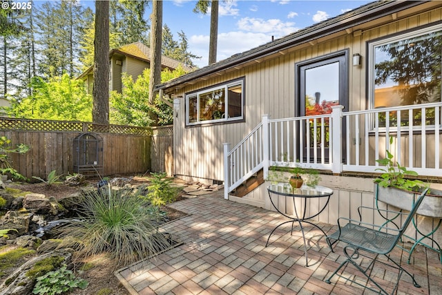 view of patio featuring fence
