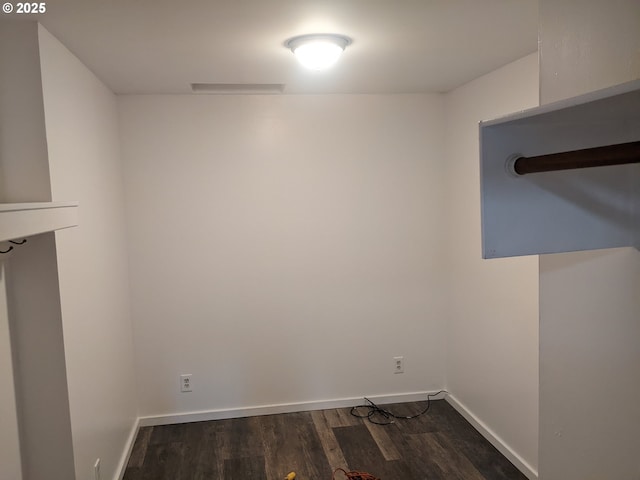 laundry area featuring dark hardwood / wood-style floors